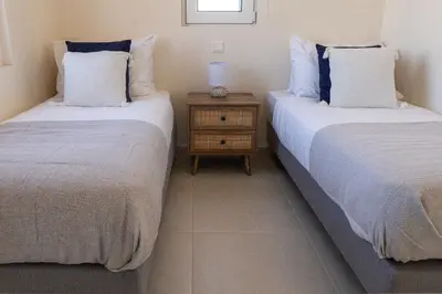 two beds sitting next to each other in a room at Phaedrus Living Seaside Thalassa Cretan 203 in Módhion