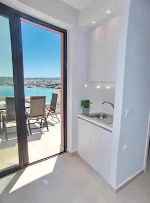 a kitchen with a sink and a view of the ocean at Bay view in town in Chania Town