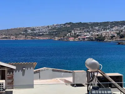 a view of a large body of water with a camera at Bay view in town in Chania Town