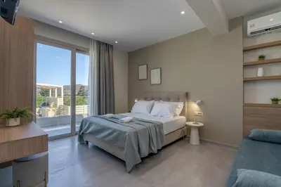 a bedroom with a bed and a large window at Villa Navelina in Mourí
