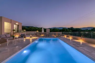 a swimming pool on the roof of a house at Villa Navelina in Mourí