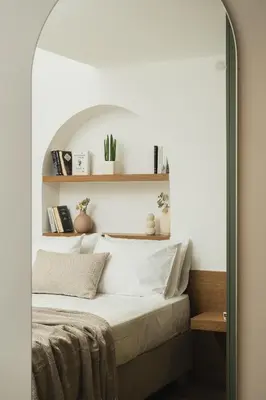 a bedroom with a bed under an archway at Thamon lifestyle living in Chania Town