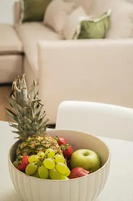 a bowl of fruit sitting on a table at Thamon lifestyle living in Chania Town