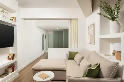 a living room with a couch and a table at Thamon lifestyle living in Chania Town