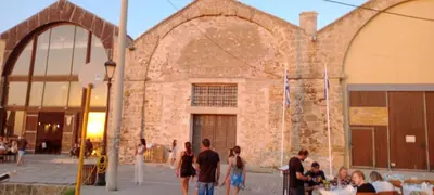 a group of people standing outside of a building at Ela Apartment Chania in Chania Town