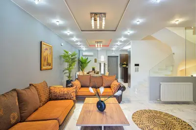 a living room with a couch and a table at Arieldine Luxury Apartment in Chania Town