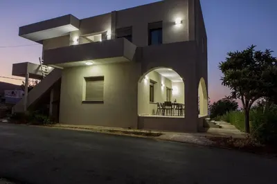 a large house with an archway on a street at Yume Luxury Home in Pírgos