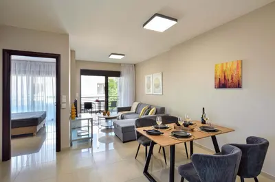 a living room with a table and a couch at Marena Apartments in Chania Town
