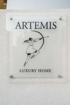 a sign that saysagents luxury home on a wall at Artemis Luxury Home in Chania Town