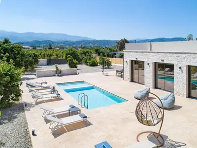 a villa with a swimming pool and a resort at PanStel - Villa Aurora with private pool jacuzzi in Ayiá