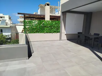 a patio with a table and chairs on a building at MC Luxury Living in Chania Town