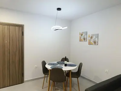 a dining room with a table and chairs at MC Luxury Living in Chania Town