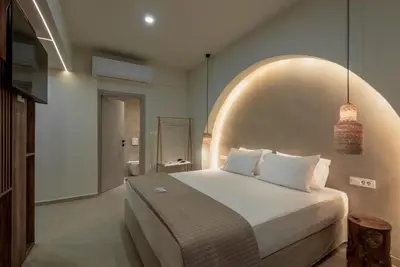 a bedroom with a large bed in a room at Devina Residence 2025 , Luxury City Jacuzzi Apartment in Chania Town