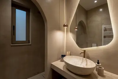 a bathroom with a large sink and a mirror at Devina Residence 2025 , Luxury City Jacuzzi Apartment in Chania Town