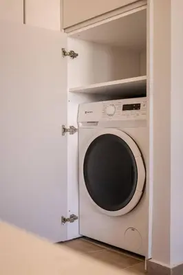 a white washer and dryer in a closet at Kira Elegant City Nest in Chania Town