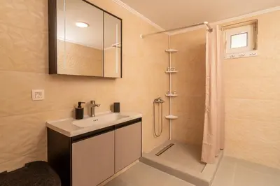 a bathroom with a sink and a shower at Casa calma! in Kountoura Selino