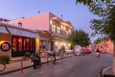 a street with motorcycles parked in front of a building at Edward Luxury Suites in Chania Town