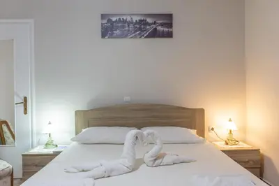 two swans made out of towels on a bed at Depi's Home in Kissamos