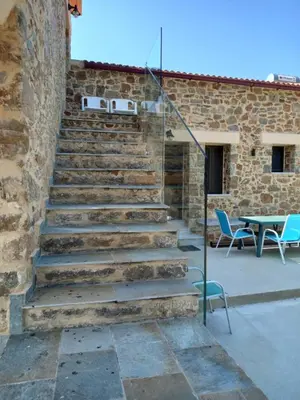 a set of stone stairs next to a brick building at Villa Makyva in Kámboi
