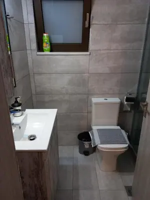 a small bathroom with a toilet and a sink at Villa Makyva in Kámboi