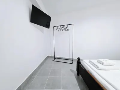 a white room with a basketball hoop on the wall at Suites with Shared Garden Sougia in Moní