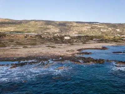 an aerial view of a beach with the ocean at Falasarna Seafront House I 50m to the Beach in Kavoúsion