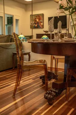 a living room with a piano and a chair at SUITEArT 2 Exceptional apartment in Chania Town
