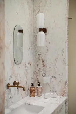 a bathroom with a sink and a mirror at Evrima High End Residence in Chania Town