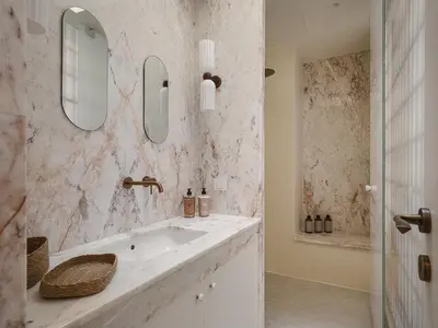 a bathroom with a sink and two mirrors at Evrima High End Residence in Chania Town