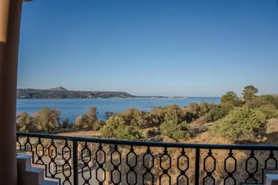 a view of the water from a balcony at Elysian Bayview Souda Bay Panorama Chania in Zakhariás