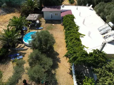 an overhead view of a backyard with a swimming pool at Panos Appartments in Palaiochóra