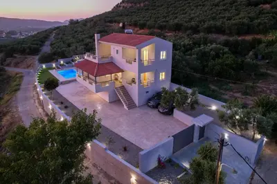 an aerial view of a house with a swimming pool at Olea Retreat Villa in Yerakianá