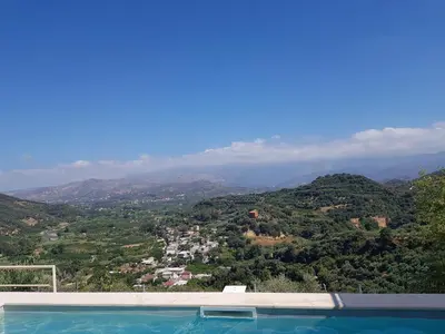 a swimming pool with a view of a mountain at Villa Orgoni in Plataniás