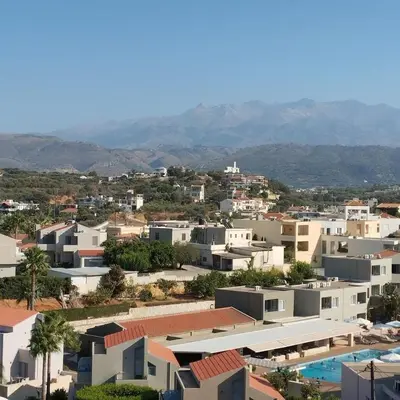 a view of a city with houses and a swimming pool at Stylish summer flat, close to beach in Daratso