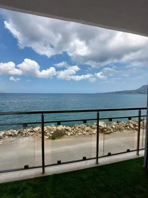 a view of the ocean from a balcony at Chavalon Apartments in Kalyves