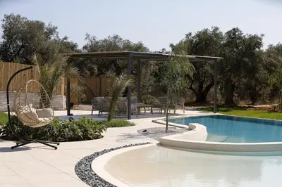 a swimming pool with a gazebo and a patio at Salisol Villa - Green Oasis in Chania Town