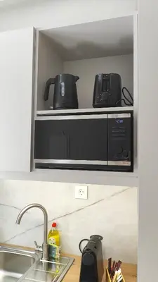 a microwave sitting on top of a kitchen counter at Dabia Escape in Chania Old Town in Chania Town