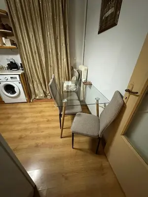 a glass table and chairs in a room at Chania City Center Apartment with Balcony Central Aircon in Chania Town