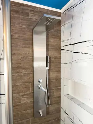a shower with a glass door in a bathroom at Suites Near Elafonisi in Élos