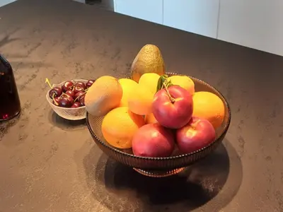 a bowl of fruit sitting on a counter at Wave Loft in Chania Town