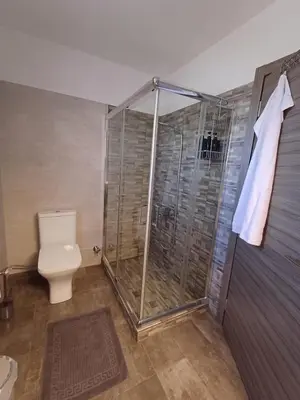a bathroom with a shower and a toilet at Wave Loft in Chania Town