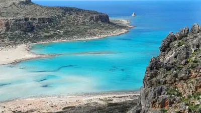 an aerial view of a beach with blue water at Wave Loft in Chania Town