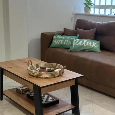 a living room with a couch and a coffee table at Kornaros House in Chania Town