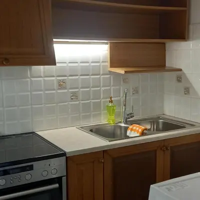 a kitchen with a sink and a counter top at Kornaros House in Chania Town