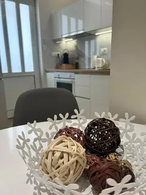 a bowl of chocolates on a table in a kitchen at Chania Moments in Chania Town
