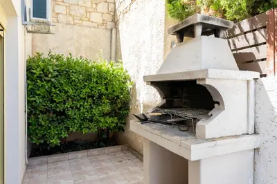 a outdoor pizza oven sitting on a patio at Sense of Dream Villas in Tavronitis