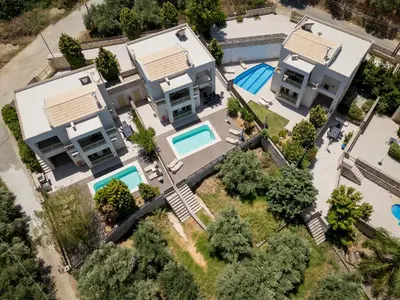 an aerial view of a house with a swimming pool at Sense of Dream Villas in Tavronitis