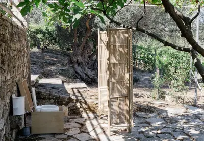 a wooden gate in the shade of a tree at Star Sleep Dourakis Winery Chania in Alikampos