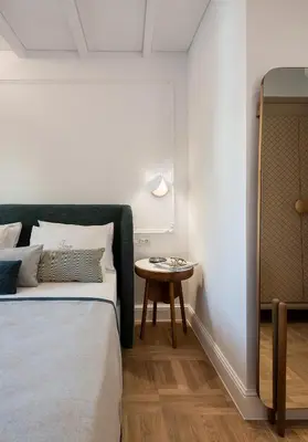 a bedroom with a bed and a table at Ionas Boutique Hotel in Chania Town