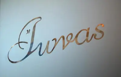 a sign with the word synacs written on a window at Ionas Boutique Hotel in Chania Town